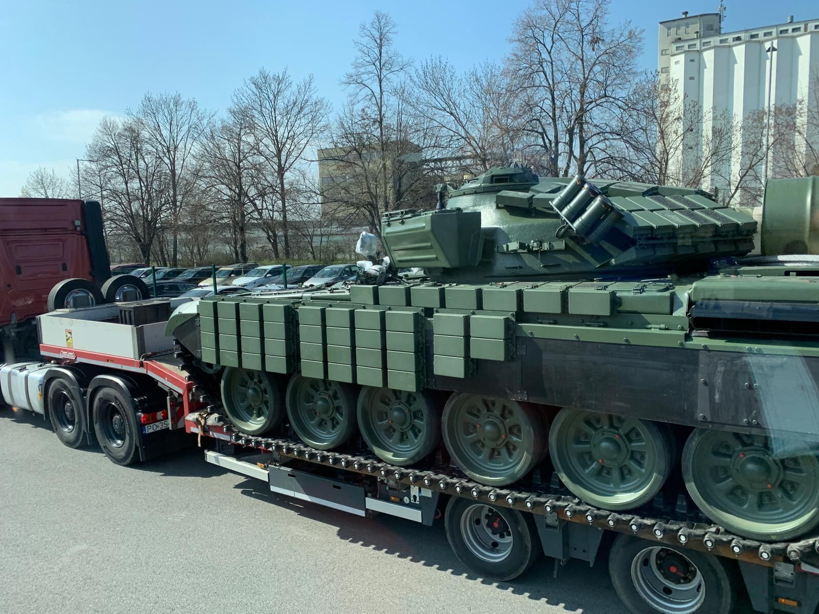 Main battle tank with reactive armour secured on a lowloader